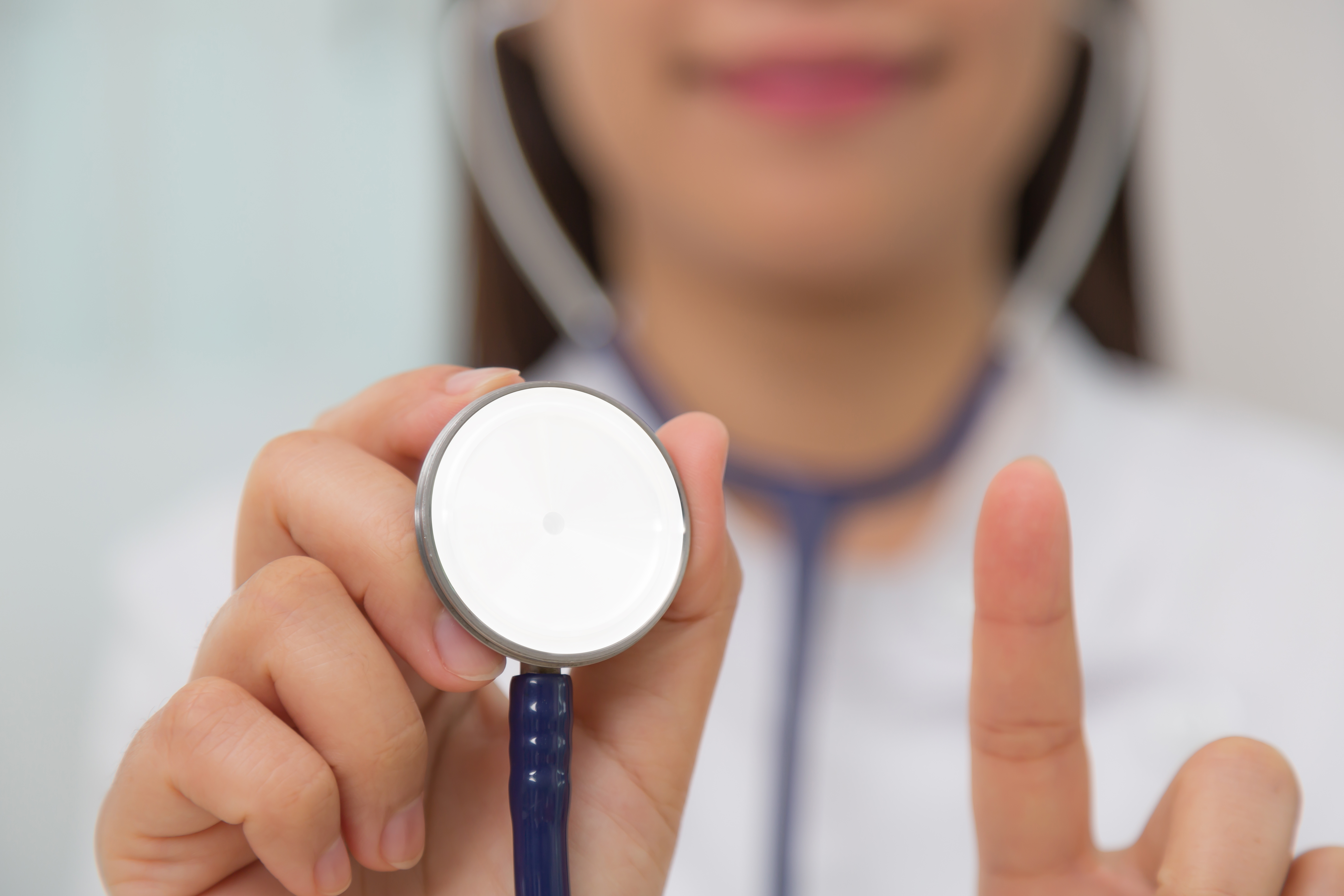 Doctor with stethoscope in the hands